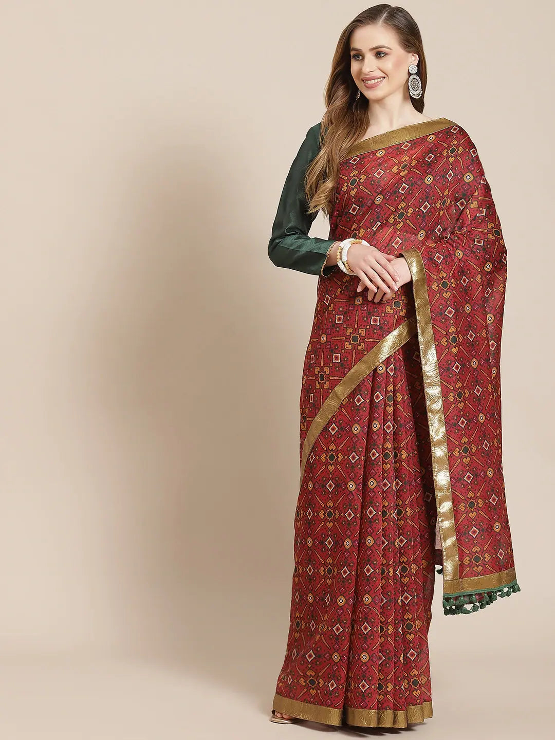 Women Maroon Patola Saree With Green Unstitched Blouse Elegant Semi-Sheer Blouse